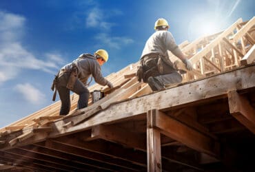 Two roofer ,carpenter working on roof