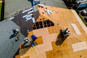 Apartment building roof underwent repairs that included installation new shingles replacing old roof